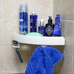 étagère d'angle dans la salle de bain avec ventouses