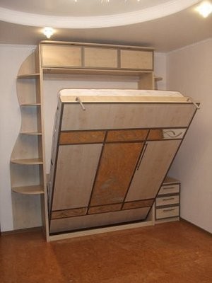 Lit armoire avec un mécanisme de levage