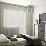 Intérieur d'une petite chambre adulte décorée dans des couleurs apaisantes.