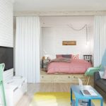 Chambre à coucher combinée avec un salon avec un lit sur le podium