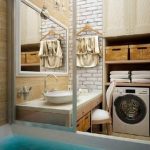 Salle de bain design avec une machine à laver dans un placard ouvert