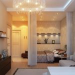 Placer un lit dans un appartement d'une pièce du même style avec un salon