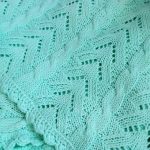 Couverture ajourée pour bébé couleur turquoise