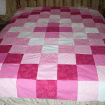 Couvre-lit patchwork dans les tons de rose