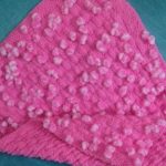 Plaid rose pâle avec pompons pour fille