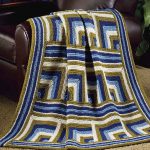 Plaid à motifs géométriques, à tricoter