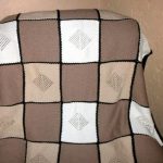 Plaid aux couleurs crème et pastel, à tricoter