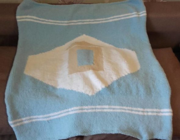 Plaid avec une maison au milieu