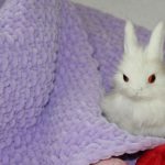 Couverture lilas en peluche