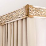 Wooden ceiling cornice with carved elements