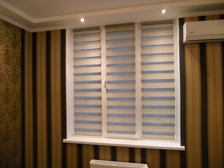 Roller blind in a room with striped wallpaper