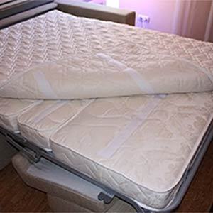 Fixation du couvre-matelas