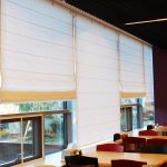 White roman blinds in the dining room