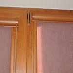 Cassette roller blinds on wooden windows