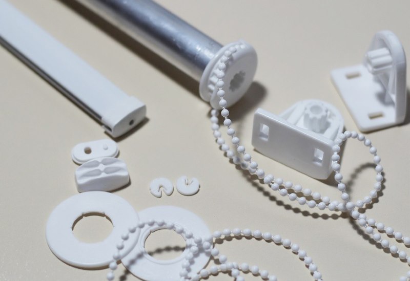 Pièces en plastique pour rideaux à enroulement
