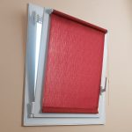 Red roller blinds for a small window