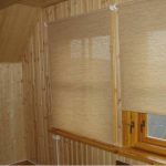 Linen curtains on the windows in the attic room
