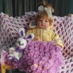 Délicat plaid de pompons lilas