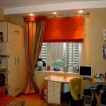 Orange roman blind in the children's room