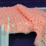 Pompons à carreaux de pêche