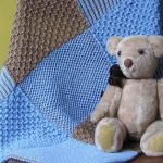 Plaid pour le bébé des carrés individuels dans des couleurs apaisantes