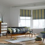 Roman striped curtains in the living room with large windows