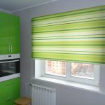 Striped yellow-green rolstor for the width of the window