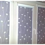 Rolled curtains with floral patterns for each sash