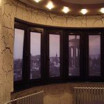 Rolled photo curtains on unusual plastic windows