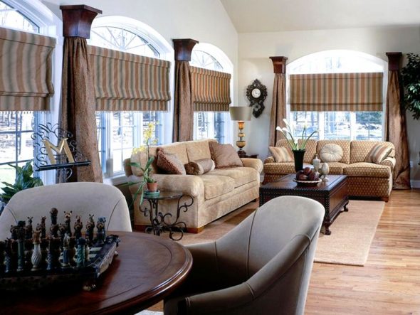 Spacious living room with roman blinds on the windows