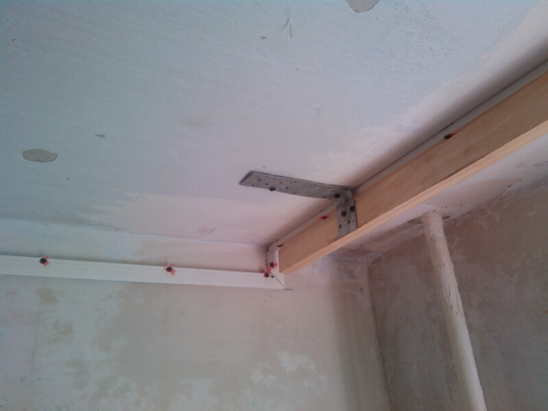 Wooden beam on the ceiling to secure the eaves