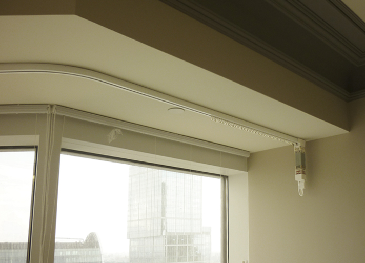 Flexible eaves with an electric drive on a loggia window