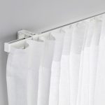 White curtain on a simple eaves of aluminum