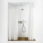 Shower curtain on a flexible ledge