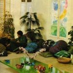 Salon avec coussins extérieurs ainsi que des canapés et des fauteuils