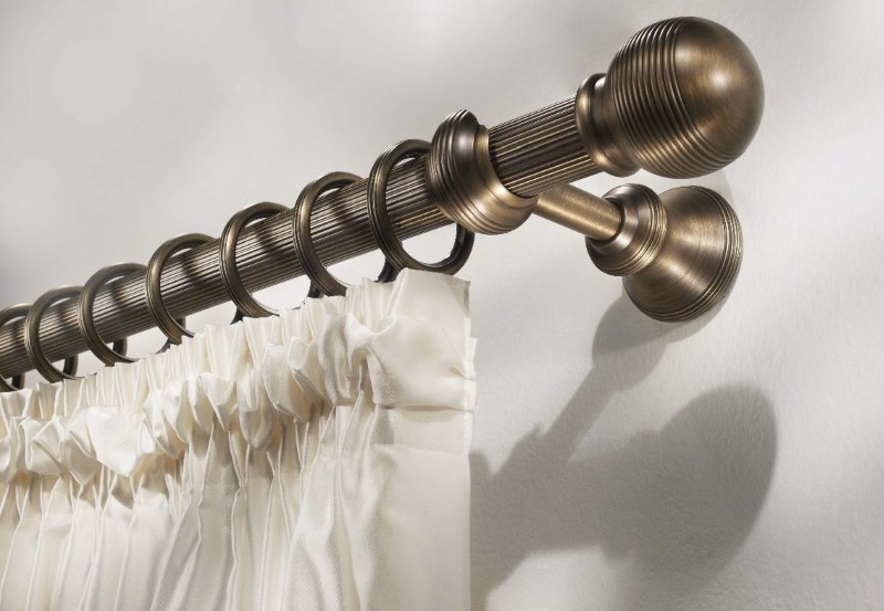 Beautiful cornice with a round barbell