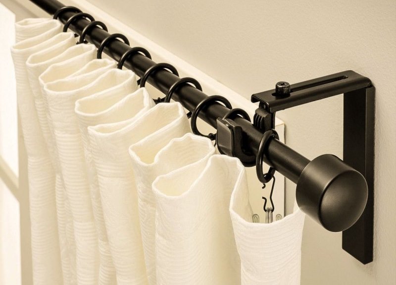 White curtain on the wall cornice