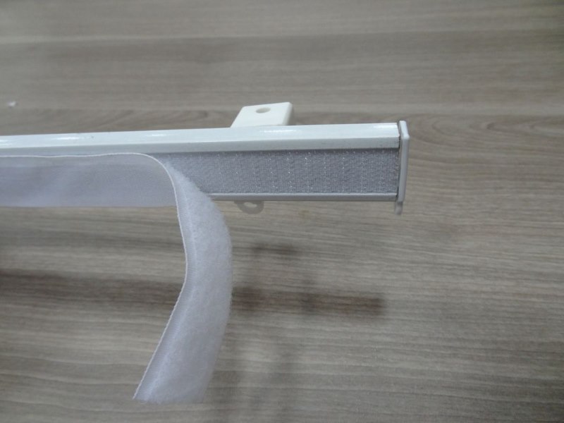 Wall cornice with adhesive tape