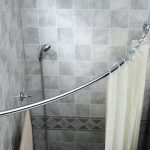 Corner shower with white curtain