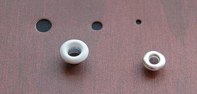 Holes for grommets in thick cardboard