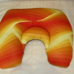 Coussin d’alimentation avec partie supplémentaire au milieu