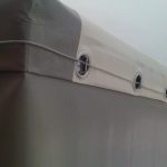 Fastening of an awning trailer on a metal cable