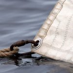 Rusty carbine in the sail eyelet