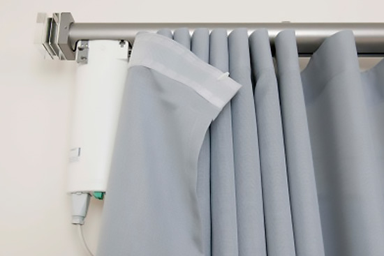 The electric drive on the eaves with a curtain
