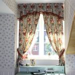 Curtains on the attic window in a private house