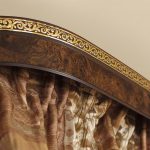 Plastic baguette with gold leaf on the living room ceiling