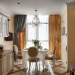 The successful combination of curtains on the window in the classic kitchen
