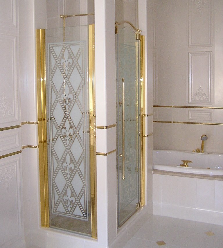Gold-plated frame on the glass doors in the shower