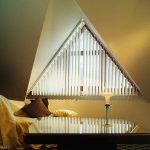 Vertical blinds on elongated fasteners in a triangular window