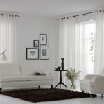 White curtains on the grommet for the hall